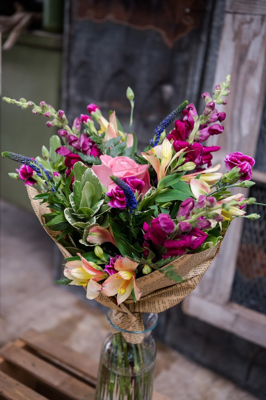 Bouquet of flowers in a glass vase. Mother's Day Flowers to be delivered in Crystal Beach or Ridgeway 